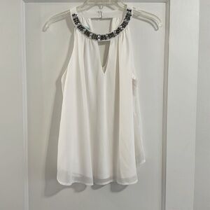 White flowy top with beaded detail